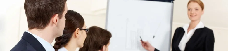 Lady speaking to three graduate recruits 