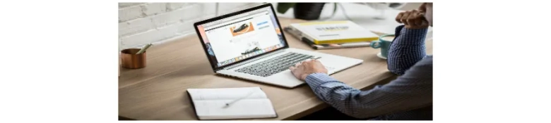 Person working on a laptop with graphs on the screen, indicating research or analysis for career development.