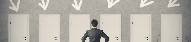 Businessman contemplating which of five doors to choose, symbolizing job search options.