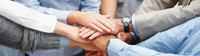 A group of hands placed on top of each other